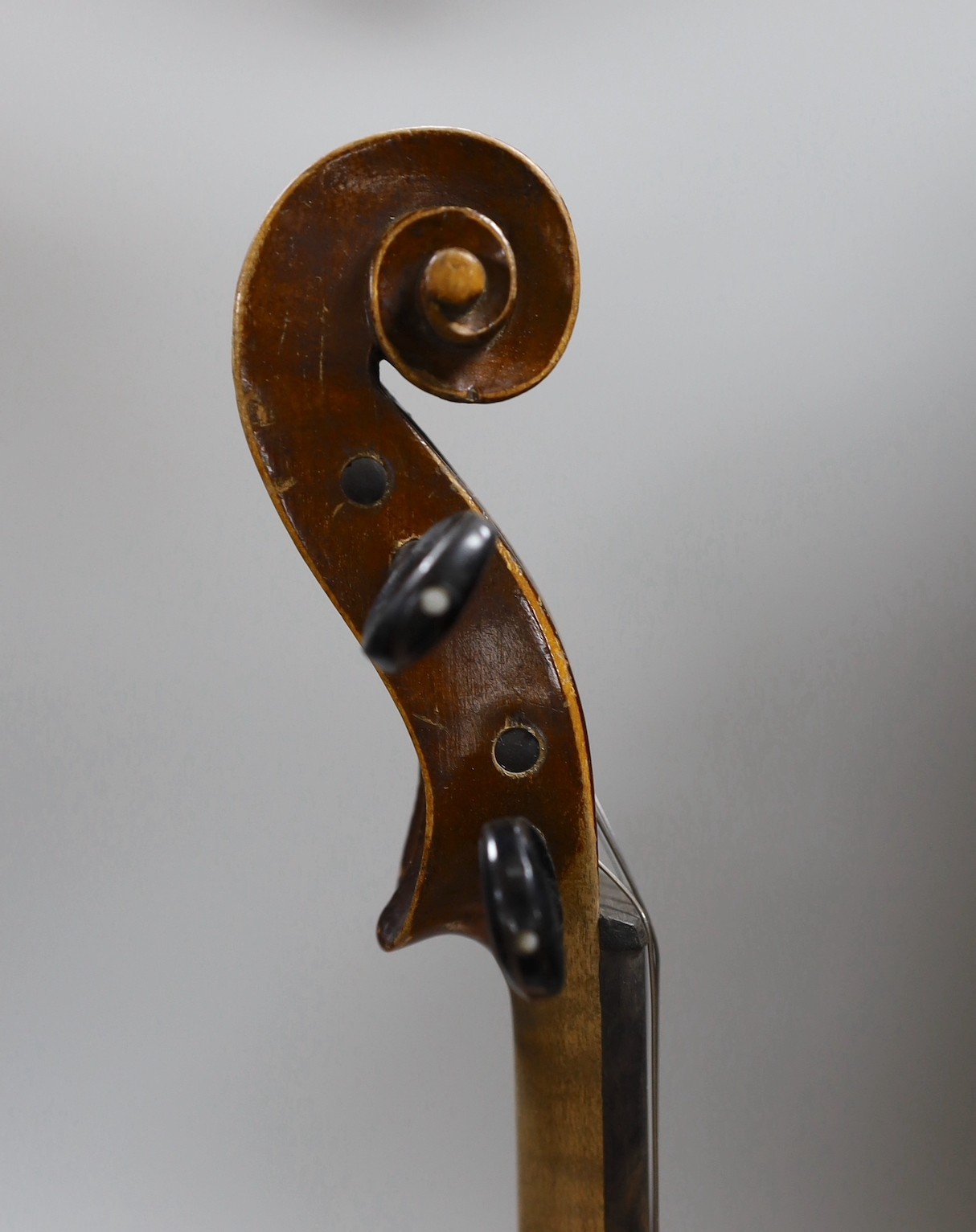 A Maidstone violin, with bow, cased. violin 59 cms high.